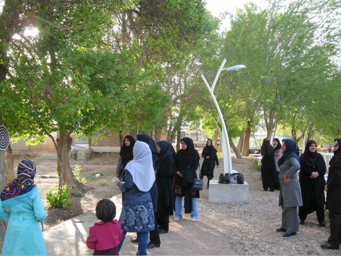 Women's Day in the camp doctor holding Nasser Mansouri, 2015